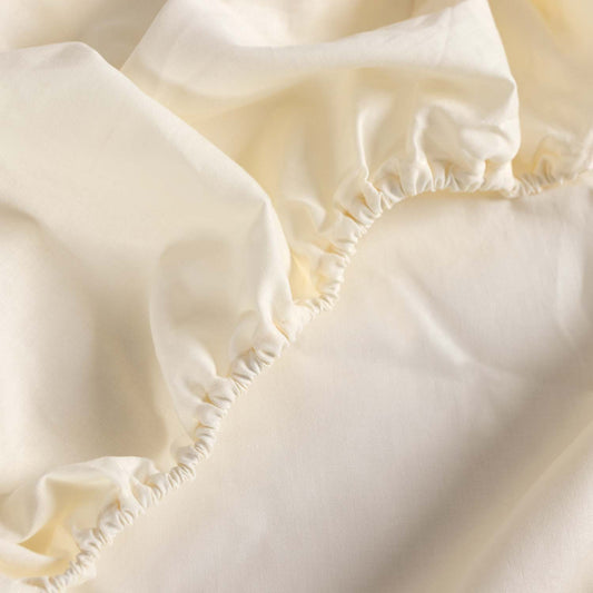 Bajera ajustable 100% Algodón Basic. Sábana bajera Lisa Crema - Blanco roto.