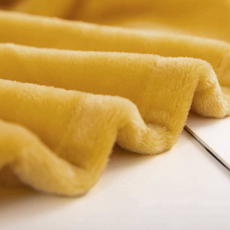 Manta polar mostaza para sofá y cama, manta grande y tacto suave.
