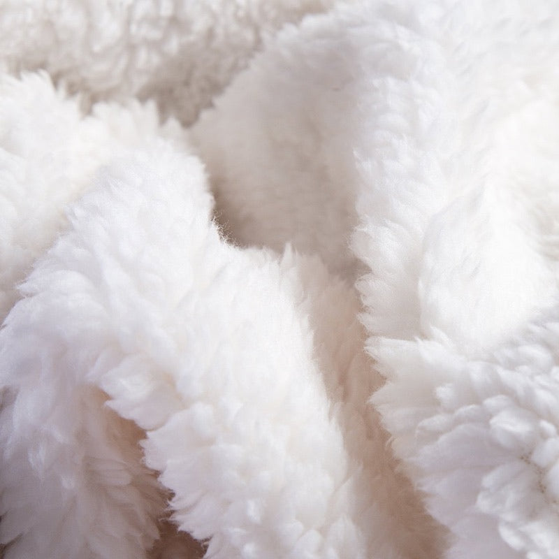 Fleece and extra soft reversible blanket. Light beige colour.