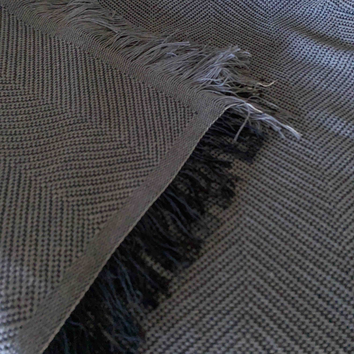 Multipurpose quilt with fringes. Dark Gray Color.