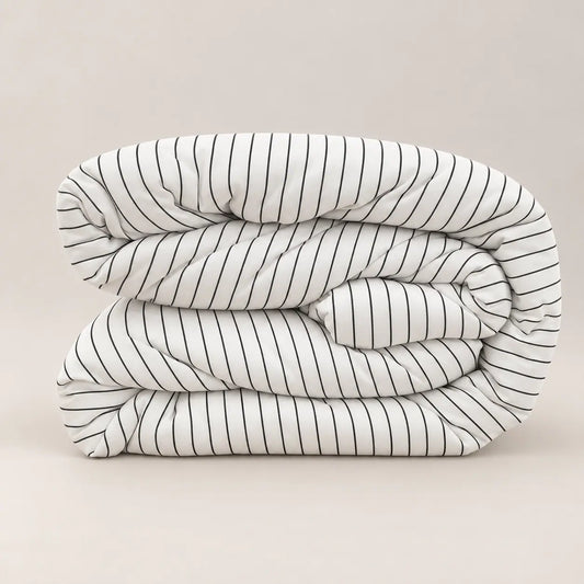 Side view of the premium duvet, highlighting its 250gsm filling and the subtle contrast between the fine-striped side and plain white reverse.