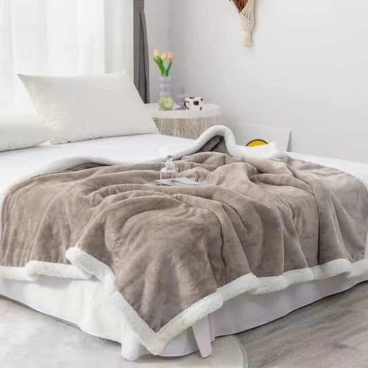 Extra soft reversible shearling blanket with border. Beige.