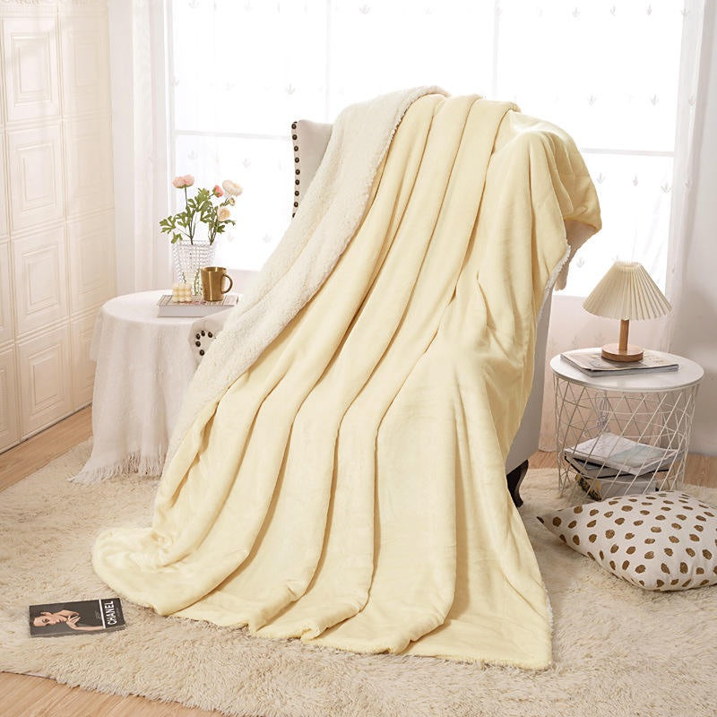Fleece and extra soft reversible blanket. Light beige colour.